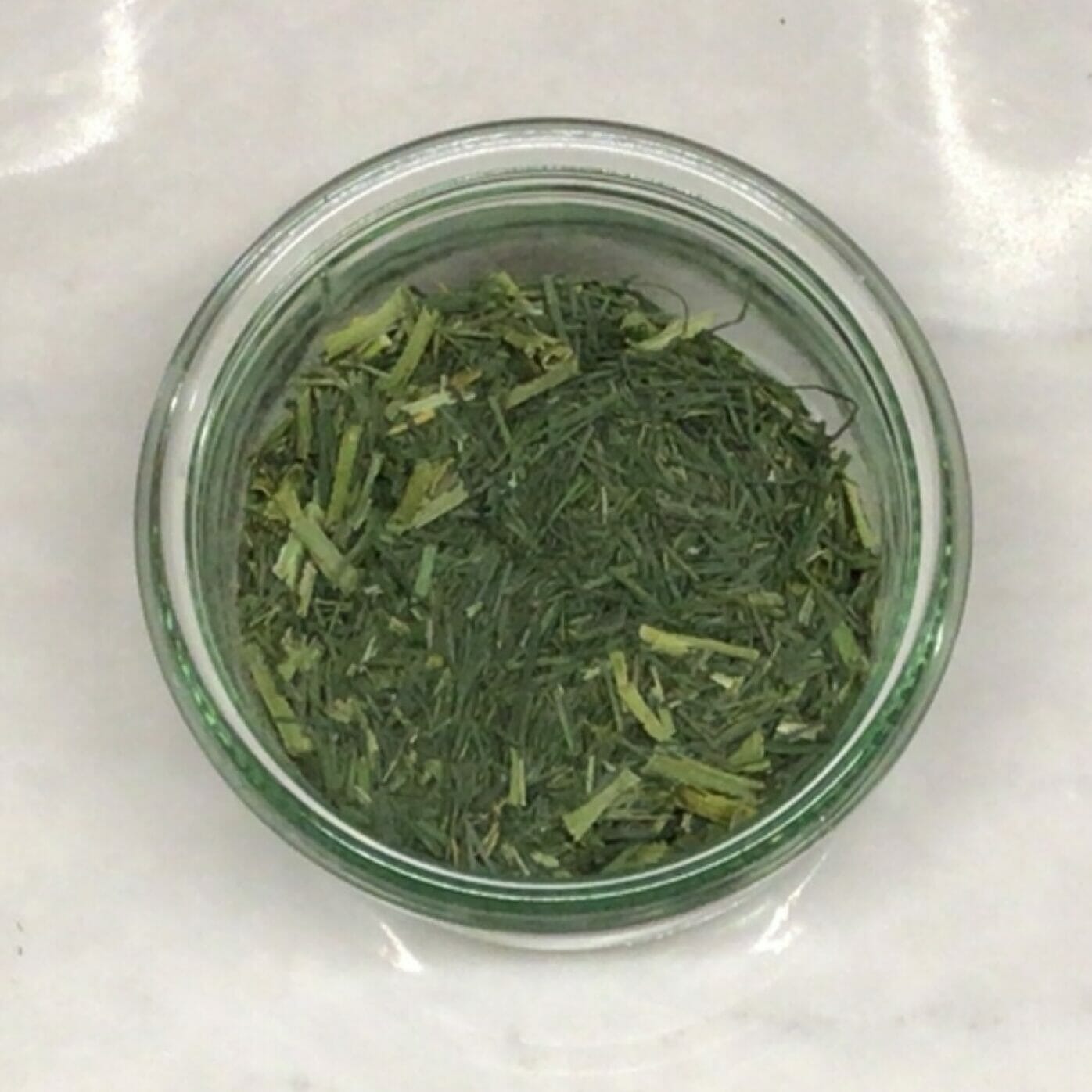 house dried chives in a glass jar sold by weight zero waste plastic-free for refills in your own container